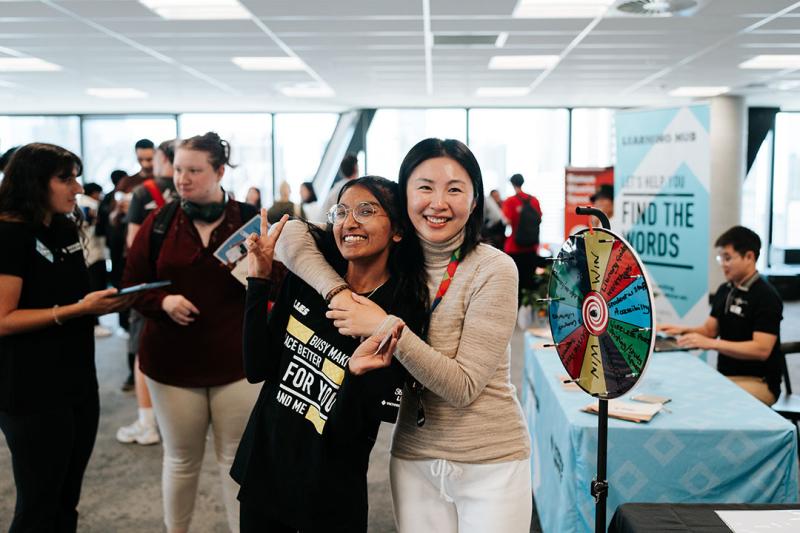 Two girls posing at City campus Ofest.