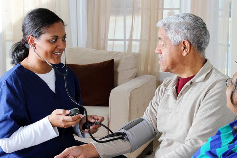 A healthcare worker with a patient.