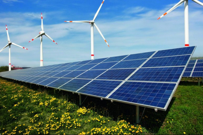 Renewable energy, wind turbines and solar panels.