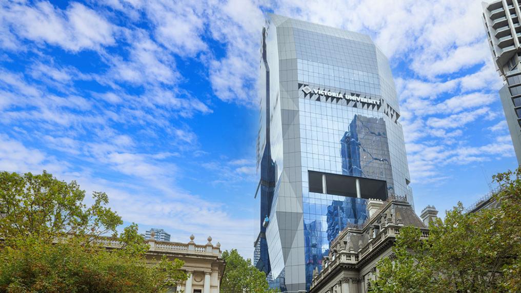 VU's imposing City Tower, behind traditional buildings and trees