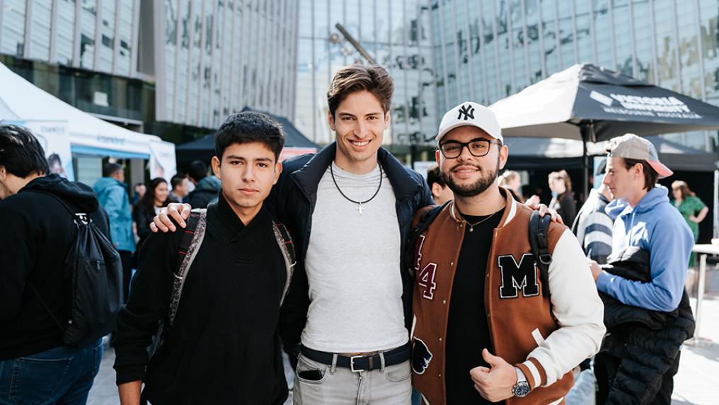 Students having fun socialising at a Block Party event, outdoors at Footscray Park Campus.